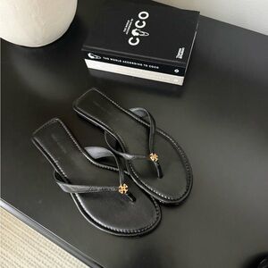 Tory Burch Black Leather Thong Sandals with Gold Logo Accent